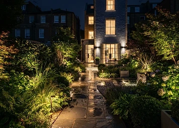 London garden path lit with low-level LED path lights by Cutting Hedge