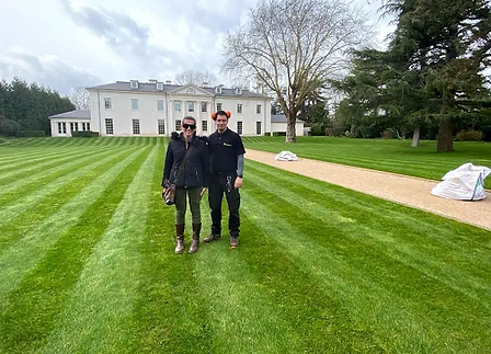 Cutting Hedge garden maintenance team on a striped lawn at a West London property