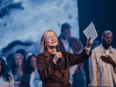 Conference speaker ministering to the audience