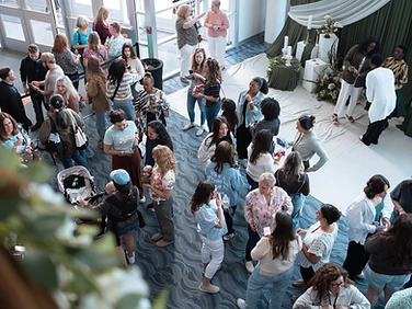 Women connecting in the conference lobby