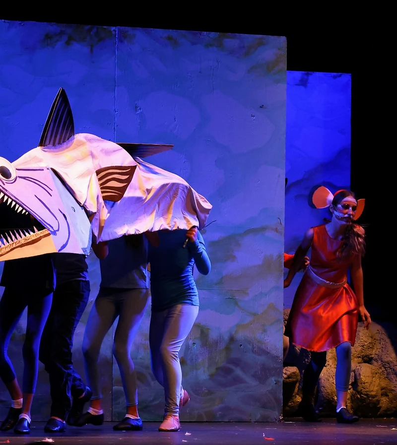 A giant fish puppet gliding across a Finding Nemo scene
