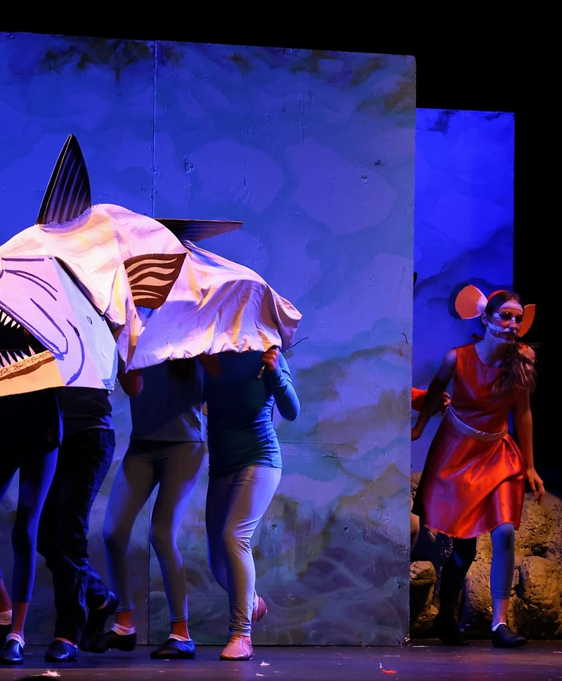 A giant fish puppet gliding across a Finding Nemo scene