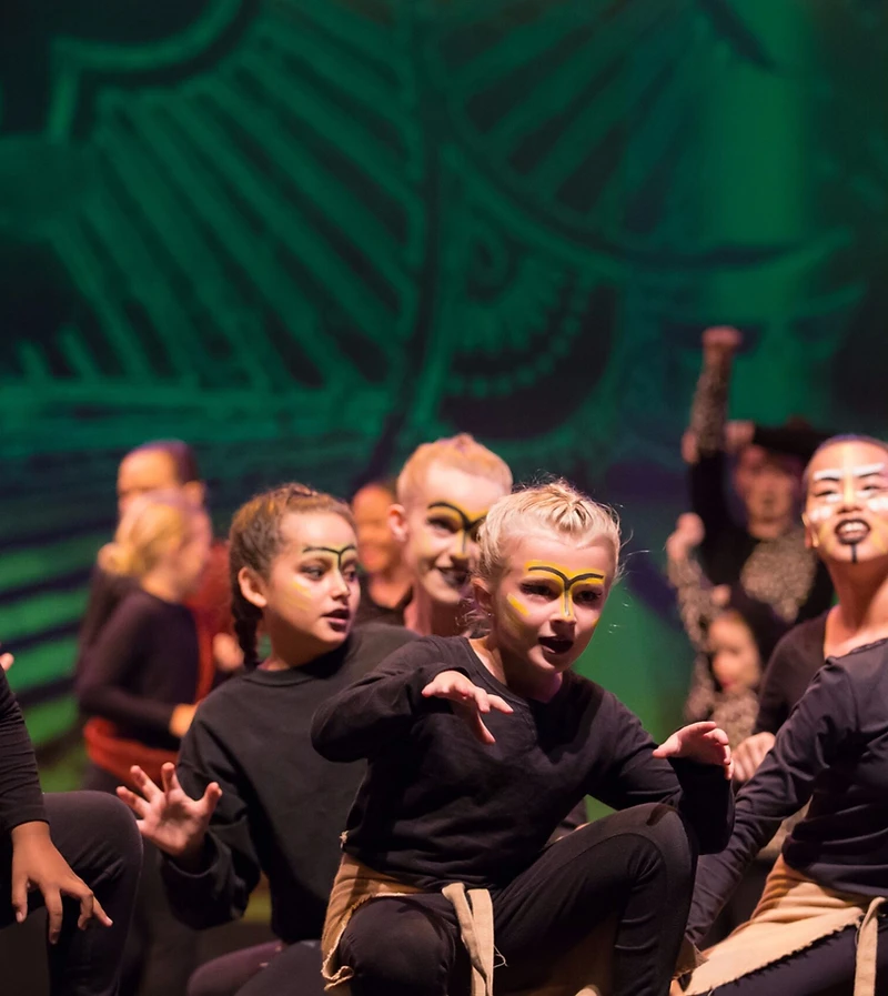 Summer Stars Lion King Jr. cast crouching in face paint
