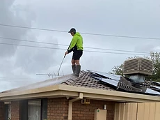Professional roof cleaning in progress
