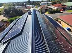 Iron roof restoration with solar panels