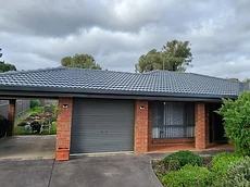 Completed dark tiled roof restoration