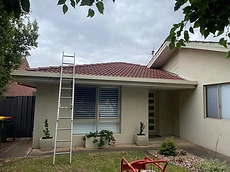 Tiled roof restoration with ladder access