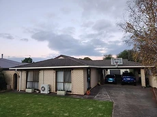 Completed tiled roof restoration at dusk