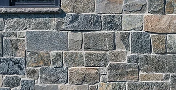 Natural stone veneer exterior wall