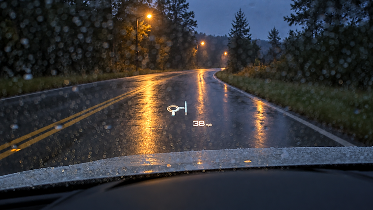 Original Audi head-up display showing a roundabout exit arrow and a speed readout on the windscreen