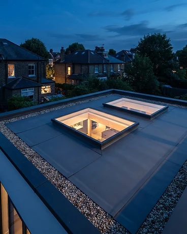 Flush flat roof lights set into a clean roof plane