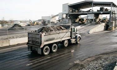 Loaded truck bed heading to a transfer station
