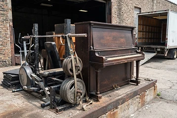 Piano and exercise equipment ready for heavy item removal