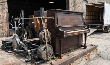 Piano and exercise equipment ready for heavy item removal
