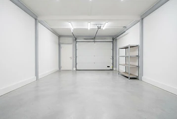 Empty cleaned-out garage after cleanout services