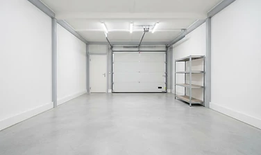 Empty cleaned-out garage after cleanout services