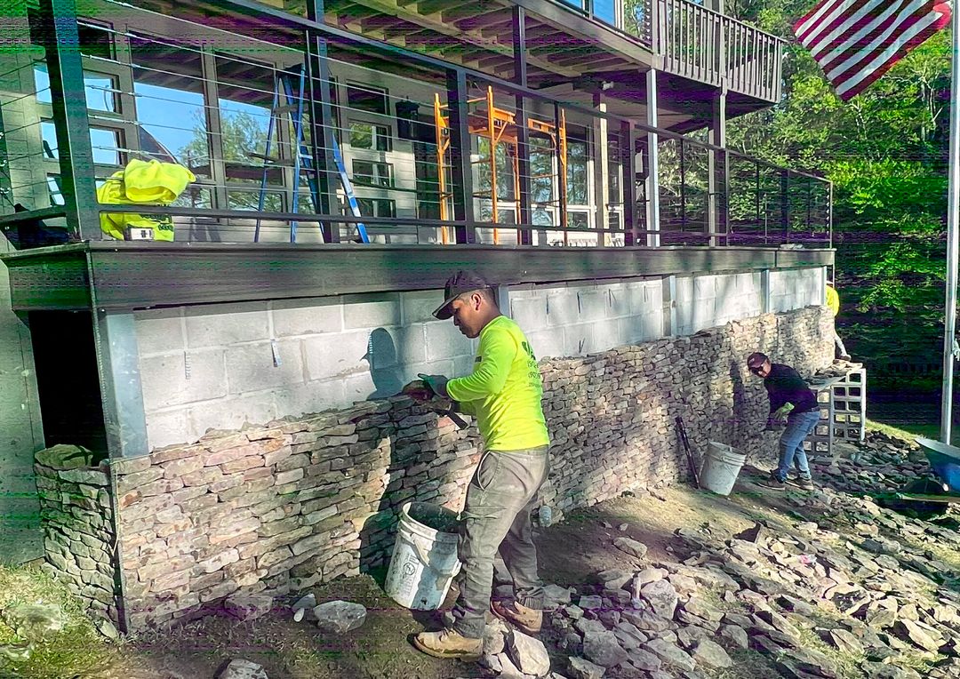 Masonry contractor building a retaining wall in Memphis
