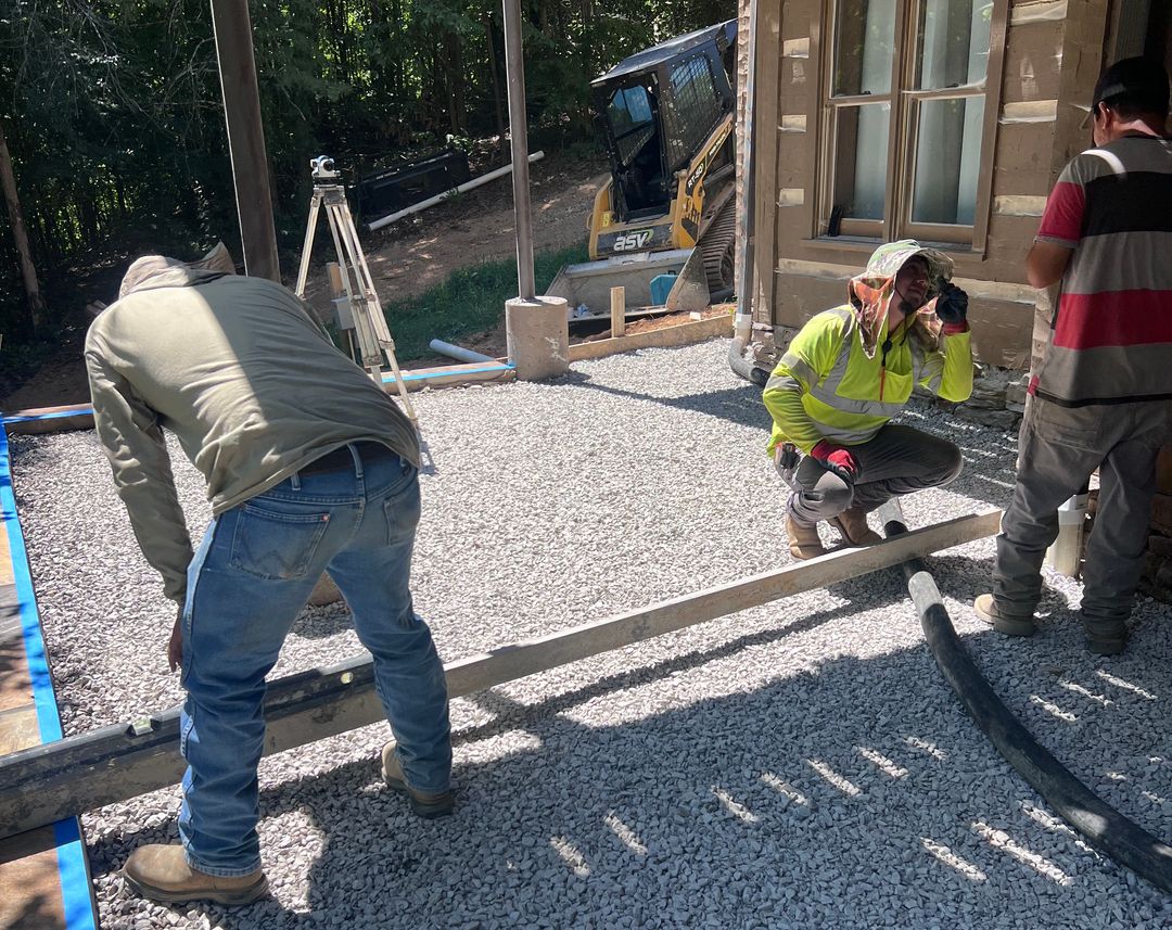 Masonry crew building a stone retaining wall