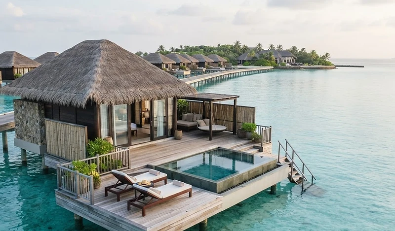 Turquoise Caribbean lagoon and overwater villa