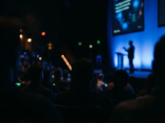 Teri Green speaking on a keynote stage