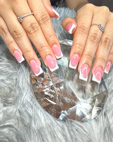 Square nails with a classic pink and white French manicure