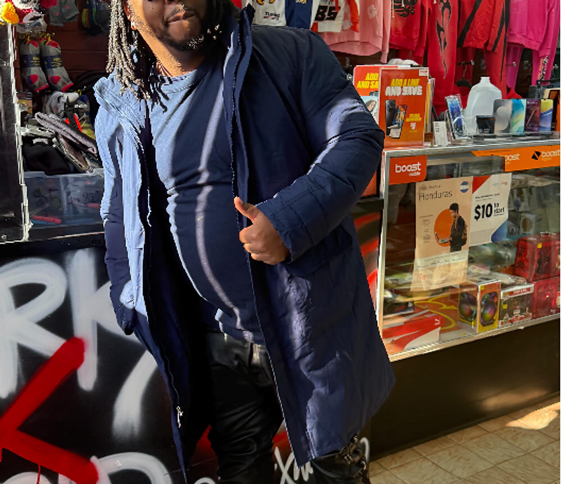 Customer in a navy coat inside the MARK X WORLD store