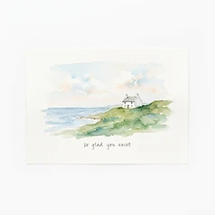 Spudied card with a watercolour cottage by the sea: so glad you exist