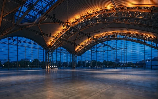 Grand exhibition hall interior at blue hour