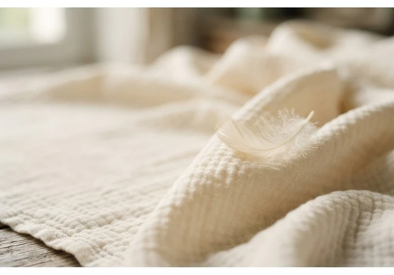 Double gaze de coton et plume