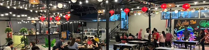 Open-air dining at Asia Thai Restaurant under lanterns