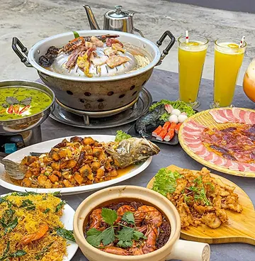 Thai dishes spread across the table for sharing