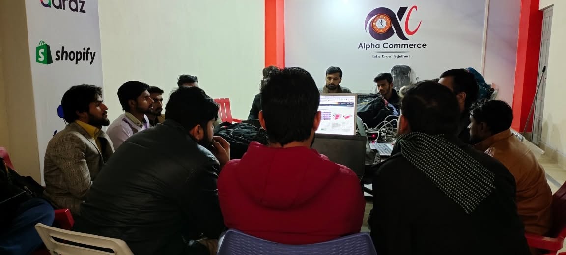 Students learning around computers