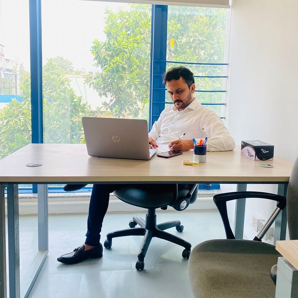 Working at desk with laptop