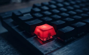 Keyboard with a single red illuminated key in dark surroundings, illustrating M3U playlist errors in IPTV players