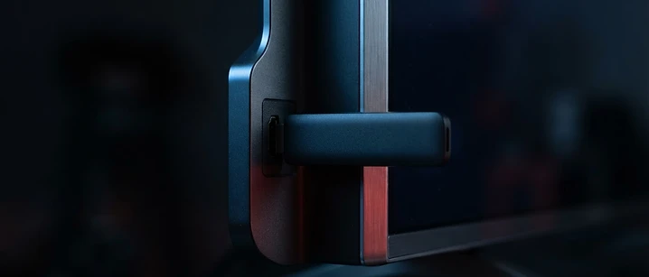 Streaming stick plugged into the side of a slim television