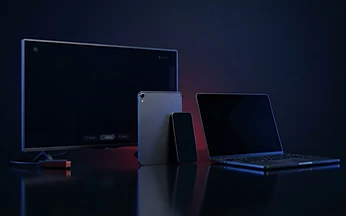 Range of streaming devices including a television, tablet and smartphone arranged on a dark surface