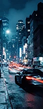 Night city street with a speeding car and light trails
