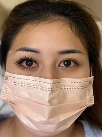 Lashes beauty work by SW Beauty — One eye finished, the other still to do — a true side-by-side.