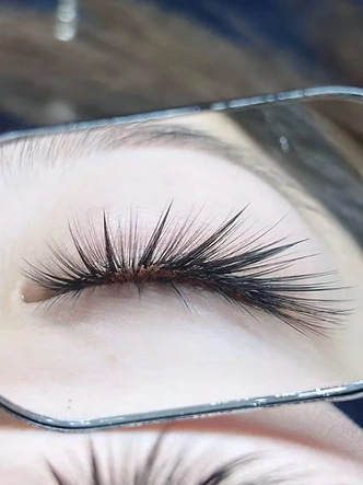 Lashes beauty work by SW Beauty — Individual lash extensions along a natural lash line.