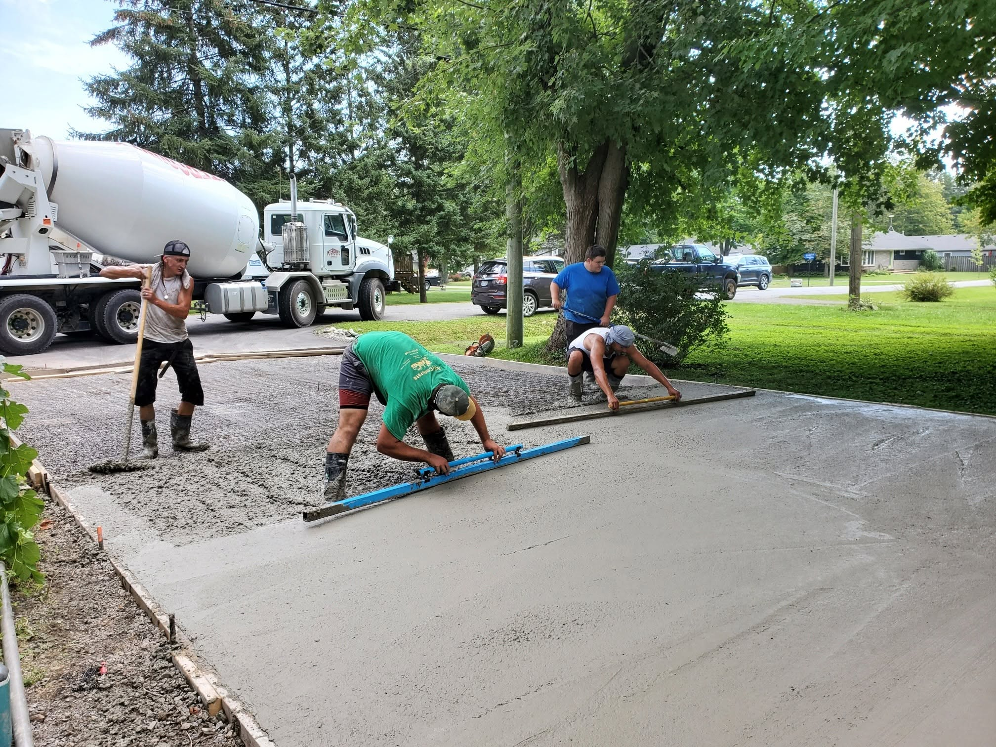 Nexxt Level Concrete crew finishing a driveway pour in Niagara