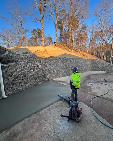 Stacked Stone Retaining Wall & Concrete Patio