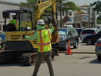 901 Lawnscape crew member working on a commercial site