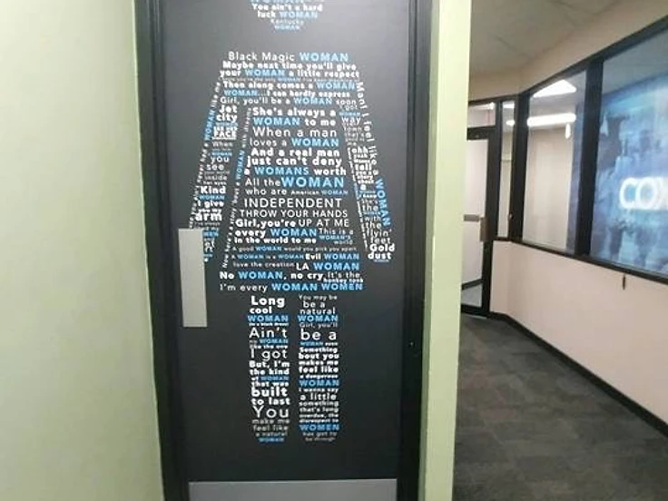 Finished office corridor and doorway inside a renovated commercial space