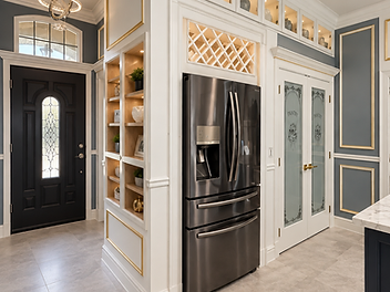 Custom kitchen cabinetry by Home Res-Q with built-in refrigerator, pantry doors and illuminated display shelving