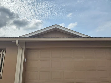 Gable repair during an exterior renovation exposing structural framing