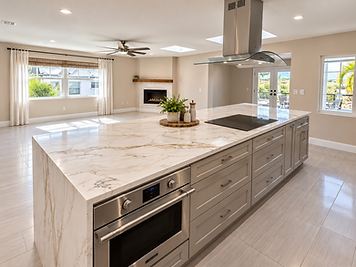 Open-concept kitchen remodel by Home Res-Q with large stone island, integrated cooktop and view of living area with fireplace