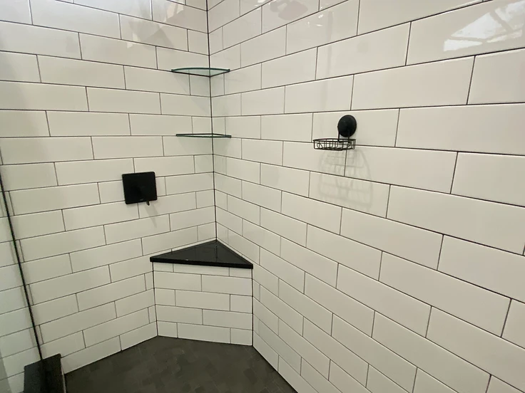 Completed tub-to-shower conversion by Home Res-Q in Hudson, FL with a larger focal-point shower replacing a jetted tub