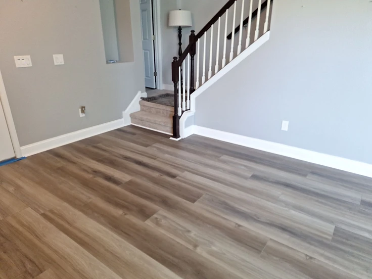 Completed flooring installation with coordinated stair treads and landing flooring
