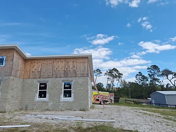 Exterior structural expansion under construction by Home Res-Q showing new framing tied into the existing home