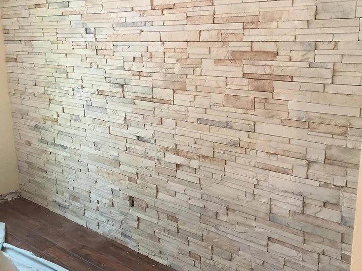 Stacked stone accent wall detail in a commercial office renovation